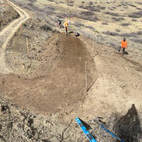 Three workers building a large switchback on the new Shale Trail
